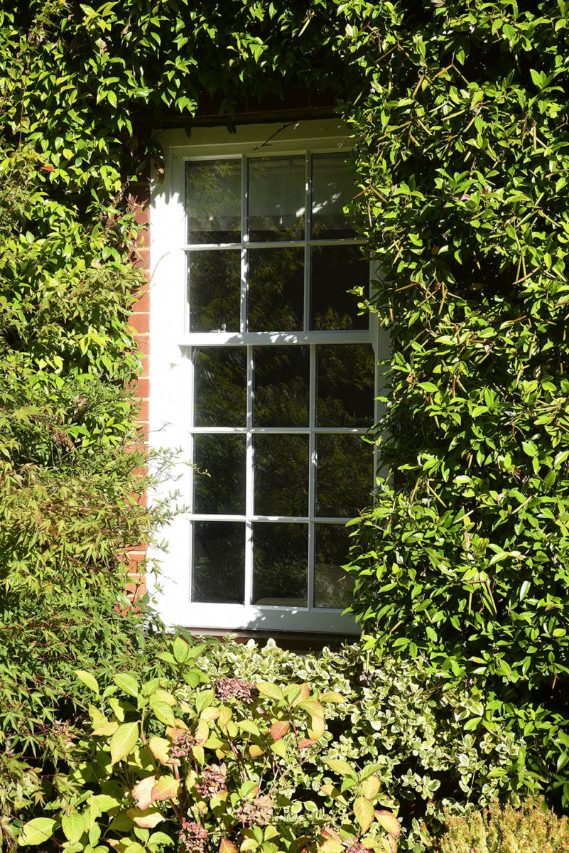Slim sash window finished in White