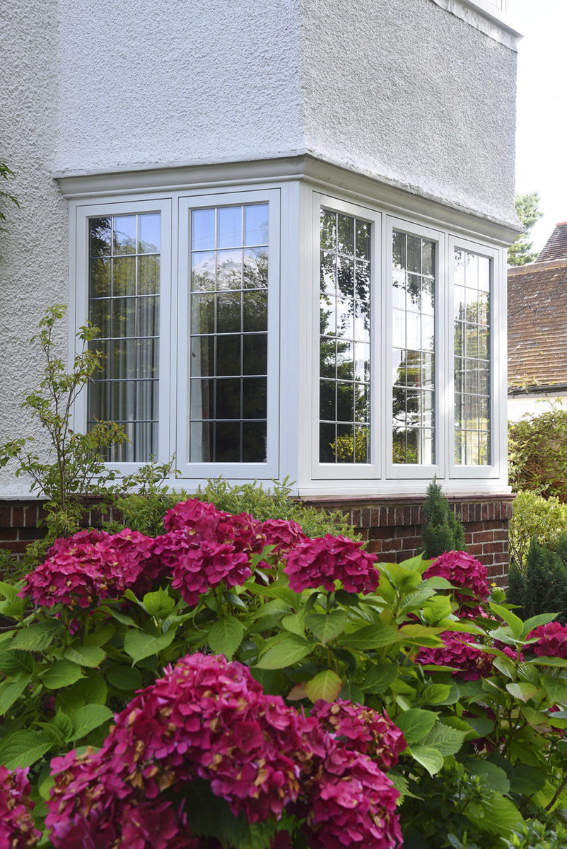 flush casement windows finished in White with leaded light detailing