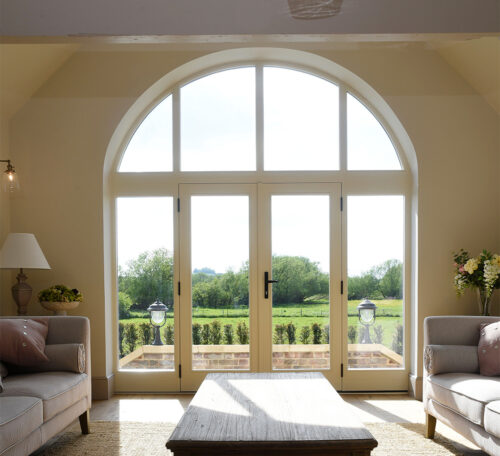 classic, timeless French doors with sidelights and an arched toplight