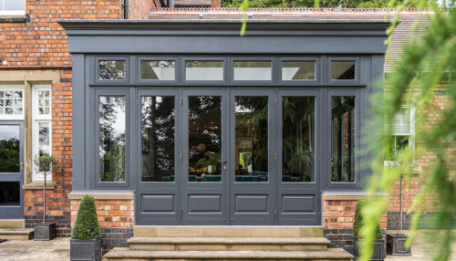 A set of French doors on a slate grey coloured sun room