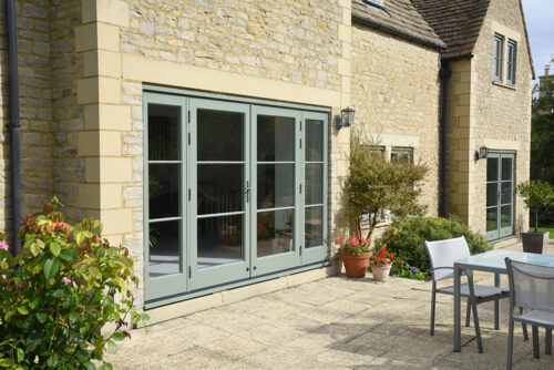 a cotswold stone property with two sets of external doors