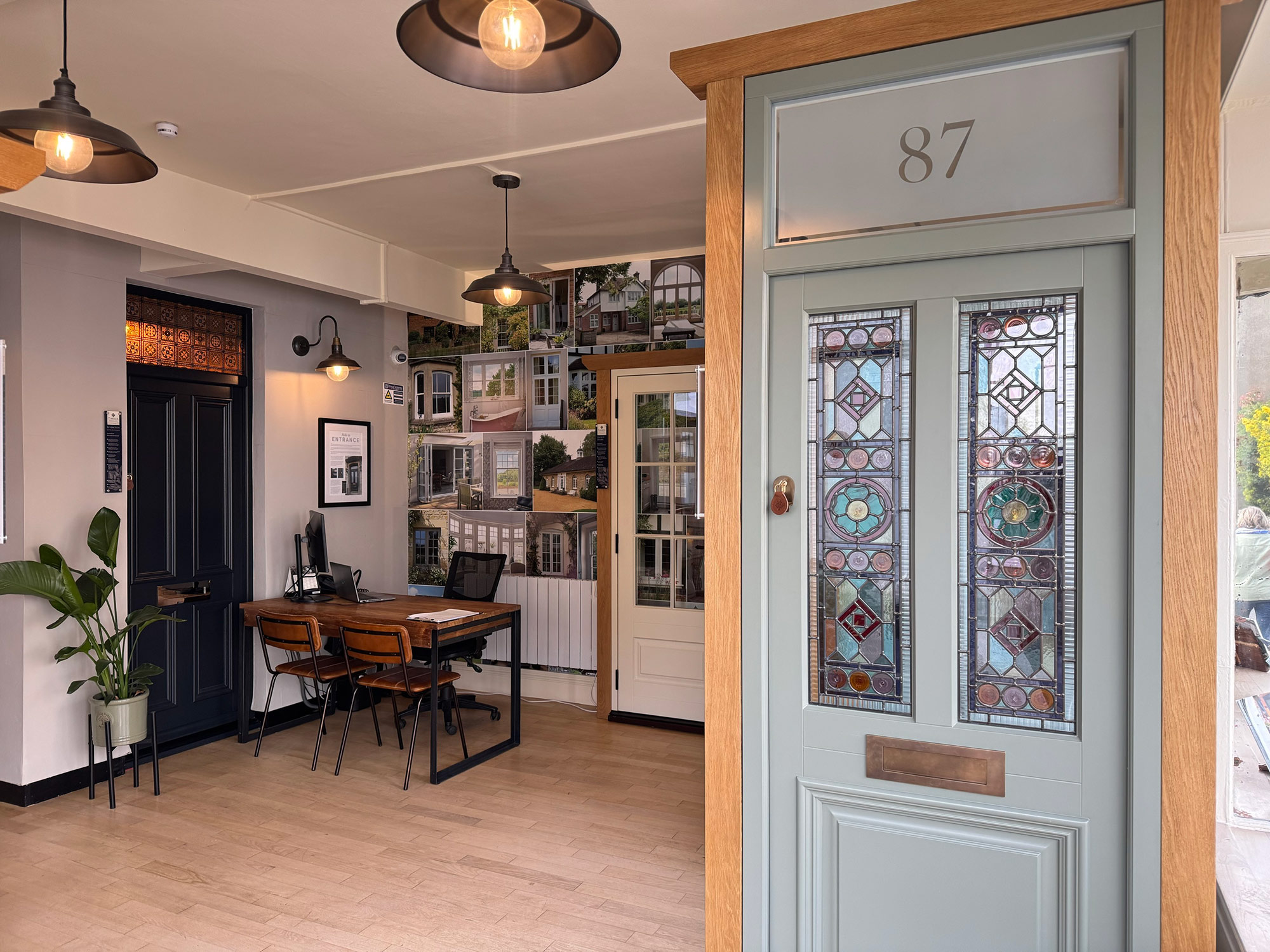 a stained glass timber front door on display in a showroom