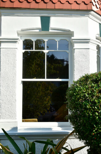a tombstone timber sash window