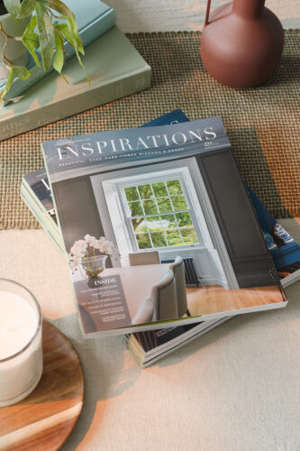 a copy of inspirations magazine on a stylish coffee table