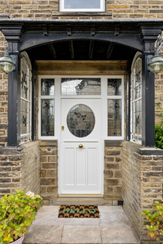 a white door with intricate lead detailing