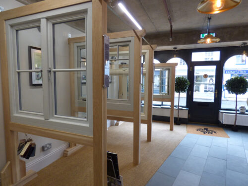 sets of casement windows on display in a showroom