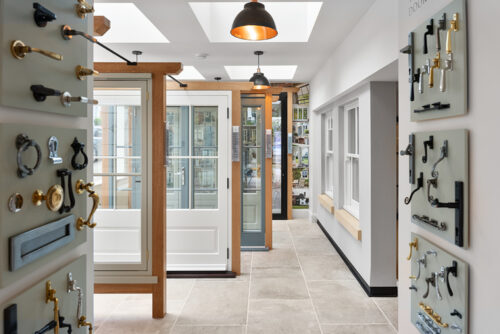 french doors and sash windows on display in a showroom