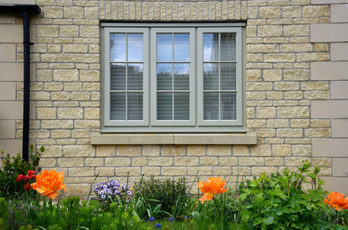 french grey casement windows on a cotswold stone property