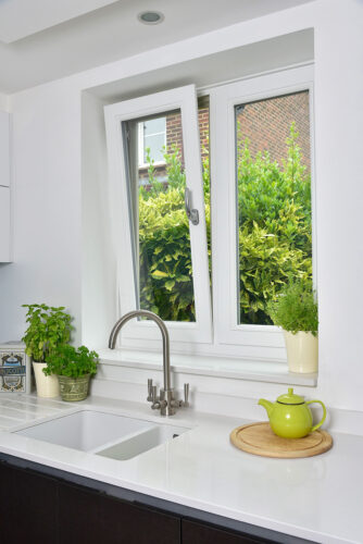 White tilt & turn casement windows in a kitchen