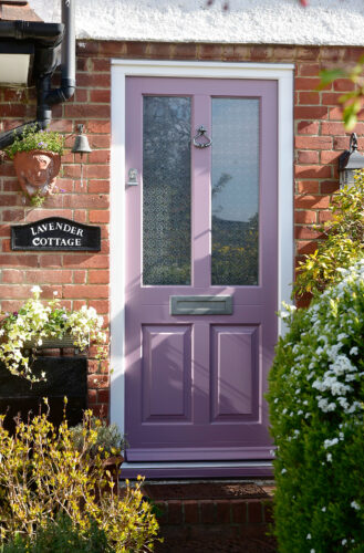 a pink victorian style front door 