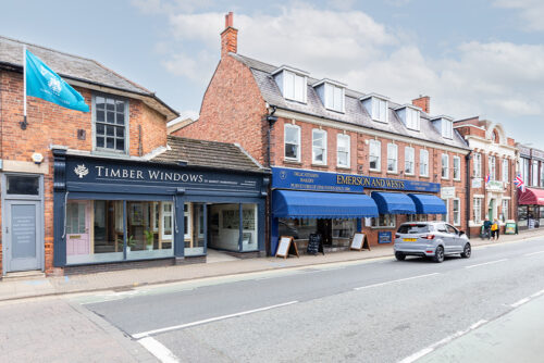 a row of shops including the timber windows of market harborough showroom