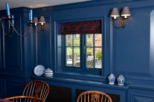 a dark blue dining room with a dark blue window