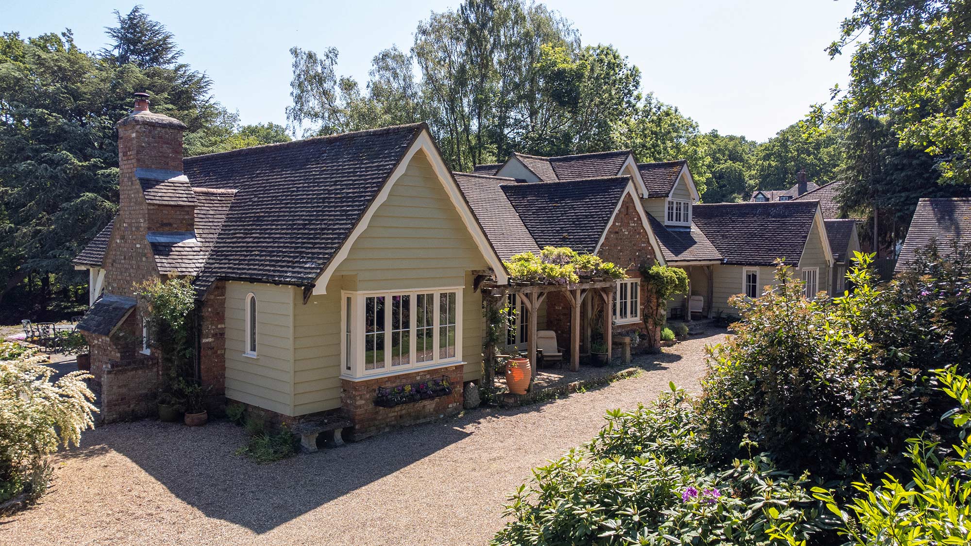 a large bungalow surrounded by woodland