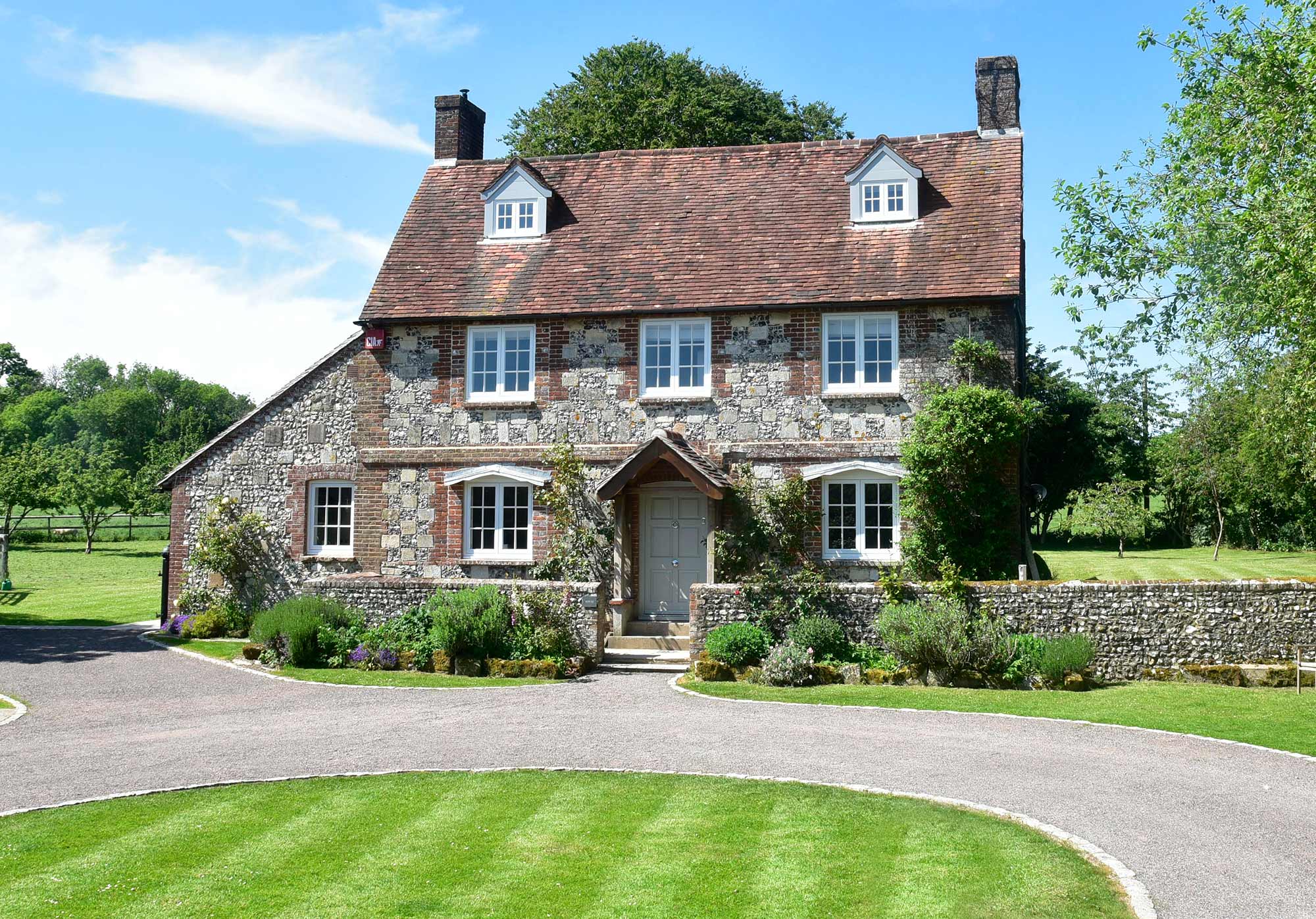 a beautiful large family home with white windows